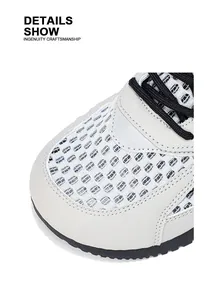 Primo piano del dettaglio della punta in mesh bianco traspirante sulle sneakers da uomo