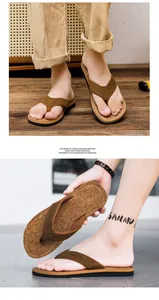 Detail shot of men's cork-textured flip-flops with brown fabric straps for beach wear.