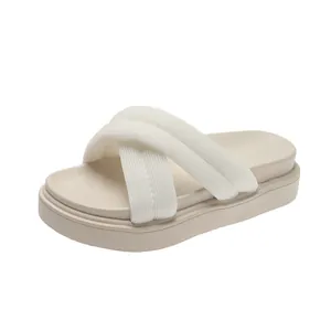 Stylish women's platform cross-strap sandals in beige and white for summer.