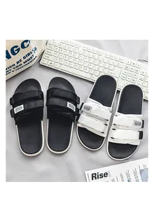 Detailed view of fashionable men's sports slides with double velcro straps