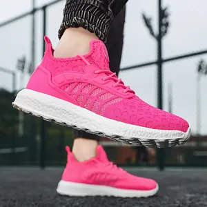 Ultra-lightweight pink flyknit running sneakers for men and women on sports court