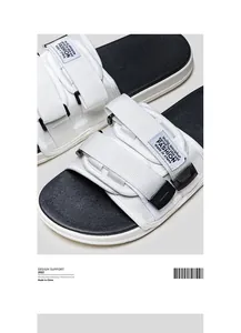 Close-up of men's sports slides with adjustable white velcro straps and black footbed.