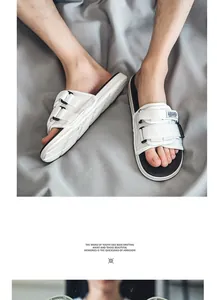 Stylish men's white sports slides with adjustable magic tape straps and non-slip soles