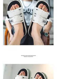 POV detail of white men's basketball slides with adjustable velcro straps