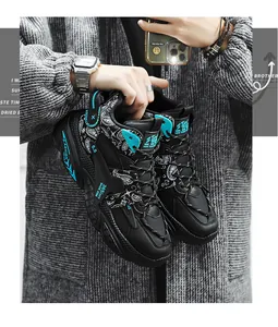 Detailed shot of black high-top basketball sneakers featuring teal accents and paisley