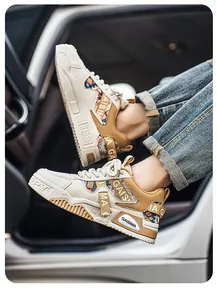 Detail view of men's chunky camo sneakers with GAISIMA branding in a car setting