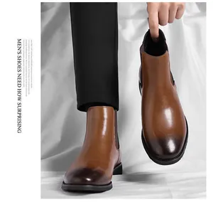 Detailed view of vintage brown leather Chelsea boots for men featuring a burnished toe