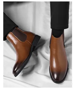 Close-up shot of vintage brown leather Chelsea boots for men with stylish gradient toe