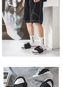 Macro detail of men's basketball slides showing adjustable velcro straps and anti-slip sole