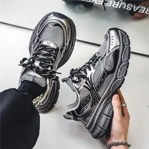 Stylish silver mesh chunky dad sneakers for men with retro sports design and thick soles.