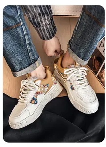Close-up view of men's outdoor chunky sneakers featuring ethnic patterns and workwear style