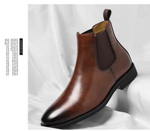 Close-up of vintage brown leather Chelsea boot with elastic side panel and black sole