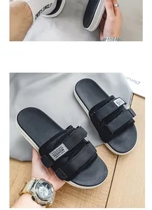 Macro view of black basketball slides featuring durable adjustable Velcro straps for men