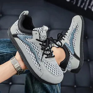 Sneaker in mesh traspirante da uomo in grigio e nero con suola morbida e leggera