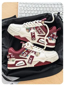 Close-up detail of trendy men's camo dad sneakers in off-white and burgundy
