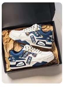 Stylish men's chunky sneakers featuring camouflage accents presented in a shoebox.