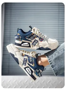 Detail of men's urban chunky sneakers with cream and navy patchwork design