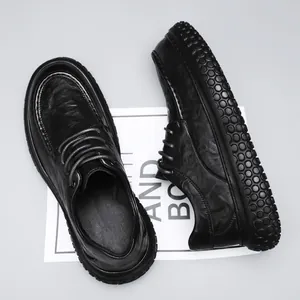 Detail shot of black leather work shoe with non-slip bubble texture sole.