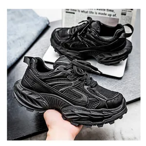 Close-up of black breathable chunky sneakers with multi-layered thick soles for men