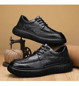 Detailed side view of premium men's black non-slip work shoes with thick textured rubber sole