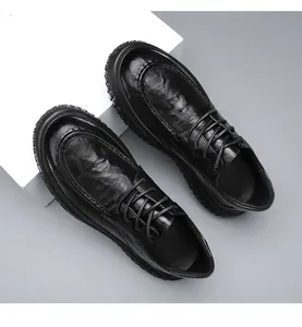 Top-down view of black slip-resistant men's leather work shoes with laces for chefs