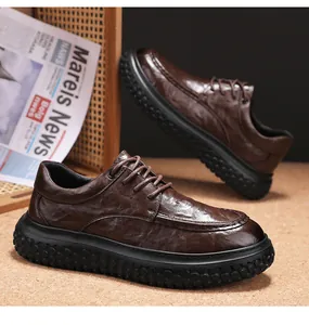 Close-up of brown textured leather men's work shoe with thick black anti-slip sole.