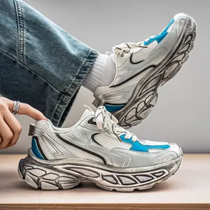Trendy men's chunky dad sneakers with thick soles and breathable blue mesh accents.