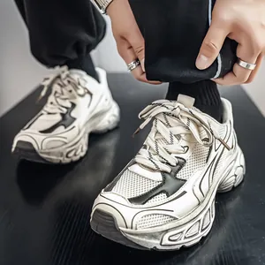 Stylish men's off-white chunky dad sneakers with thick soles and breathable mesh design