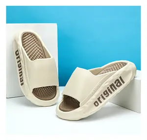 Detail shot of off-white cushioned slides for men featuring 'original' side branding