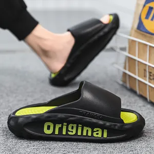 Men's stylish black slides featuring lime green insoles and Original text print side