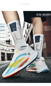 Close-up street view of white breathable men's sneakers with vibrant color accents