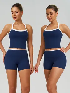 Navy blue high-waist yoga set with white trim, featuring crop top and tight shorts