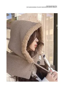 Detail shot of a brown knitted balaclava with soft plush lining and button accent.
