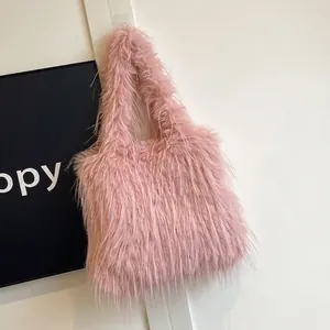 Large capacity pink faux fur tote bag for women featuring a fluffy shaggy texture