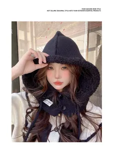 Close-up of a cozy black knitted Balaclava hood scarf worn by a model