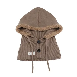 Warm brown knitted balaclava hood with fuzzy trim and button closure for winter
