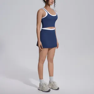 Side view of navy blue two-piece yoga set featuring contrast white trim and sporty skort.