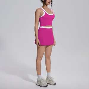 Full-body view of hot pink and white ribbed athletic skort set for yoga and fitness
