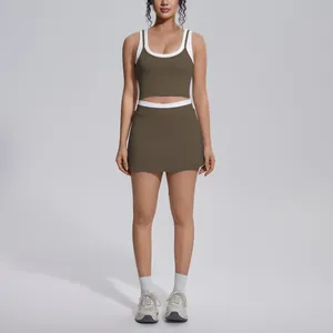 Front view of a model wearing a brown color-block ribbed yoga tank and skort set
