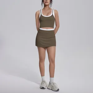 Full view of contrast color yoga set featuring high-waist skirt and rib crop top