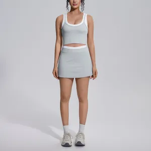 Stylish light grey contrast yoga set featuring sports tank top and matching high waist skirt