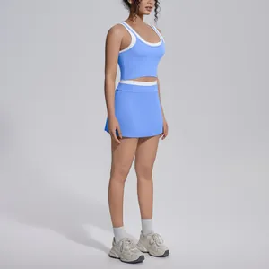 Detailed view of women's light blue two-piece yoga activewear set with white contrast trim