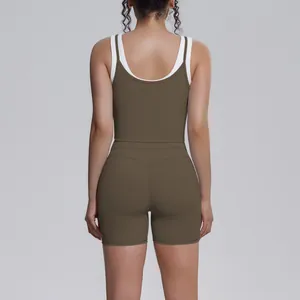 Back view of a ribbed two-piece yoga set featuring olive green and white contrast