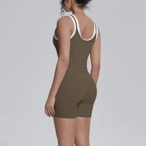 Detailed back view of a high-waisted olive green ribbed yoga set with white trim