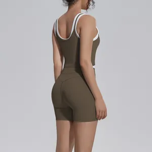 Rear view detail of a stylish brown and white contrast ribbed yoga set with shorts