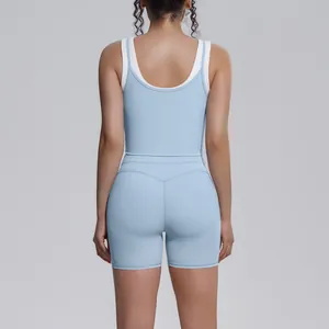 Back view of light blue and white color block yoga tank top and high waist shorts set.
