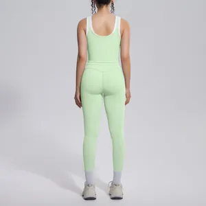 Back view of a light green ribbed yoga set featuring a contrast color sports tank top