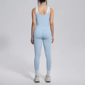 Back view of light blue color-block ribbed yoga set with high-waisted leggings for fitness.