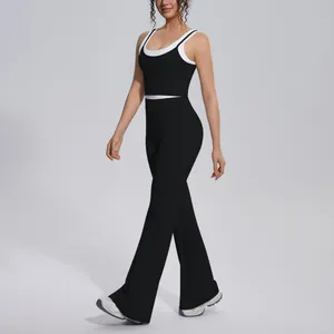Detailed view of a black and white color-block yoga set with high-waist flared pants