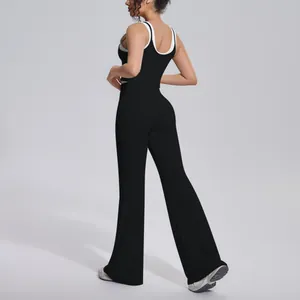 Rear view of a black color-block yoga set featuring flared high-waist pants and tank top.